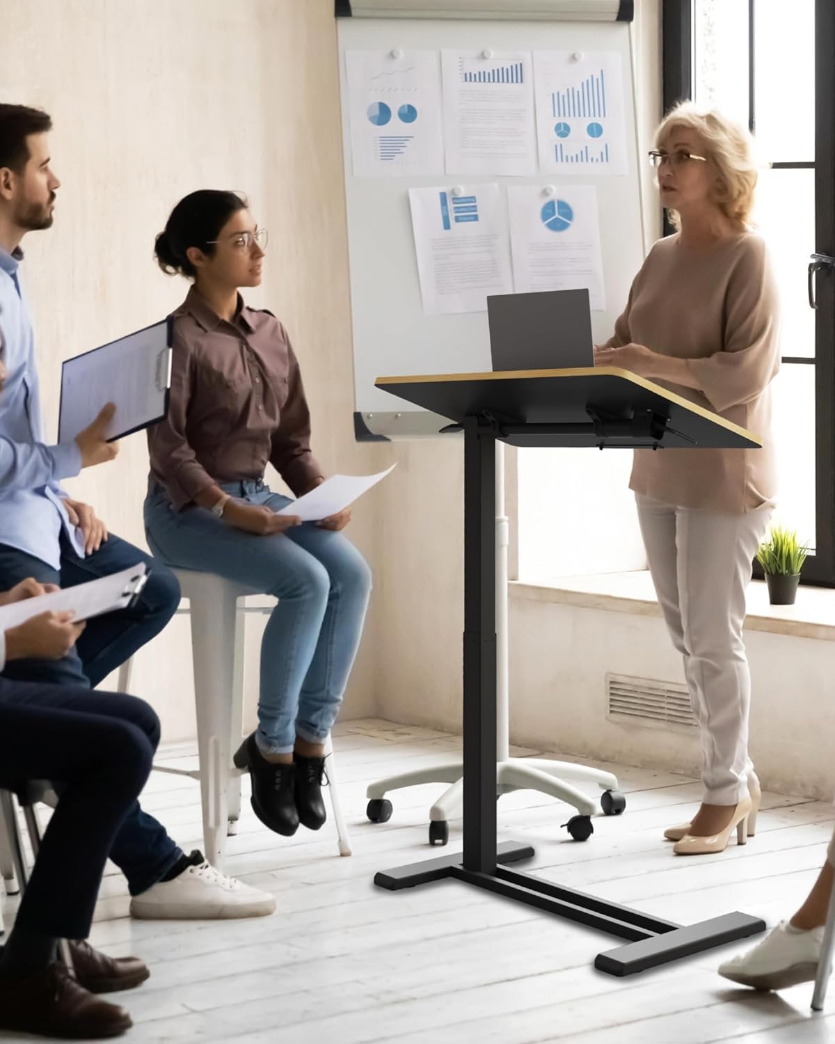 SANODESK Medical Adjustable Overbed Bedside Table with Casters 90° Tilt Top Pneumatic Mobile Rolling Laptop Computer Standing Desk Cart with Tray, Hospital and Home Use(27.6" W x 15.7" D, Black)